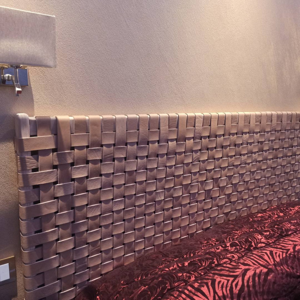 Side angle view of a modern rustic woven strap leather headboard, emphasizing clean lines and premium craftsmanship.